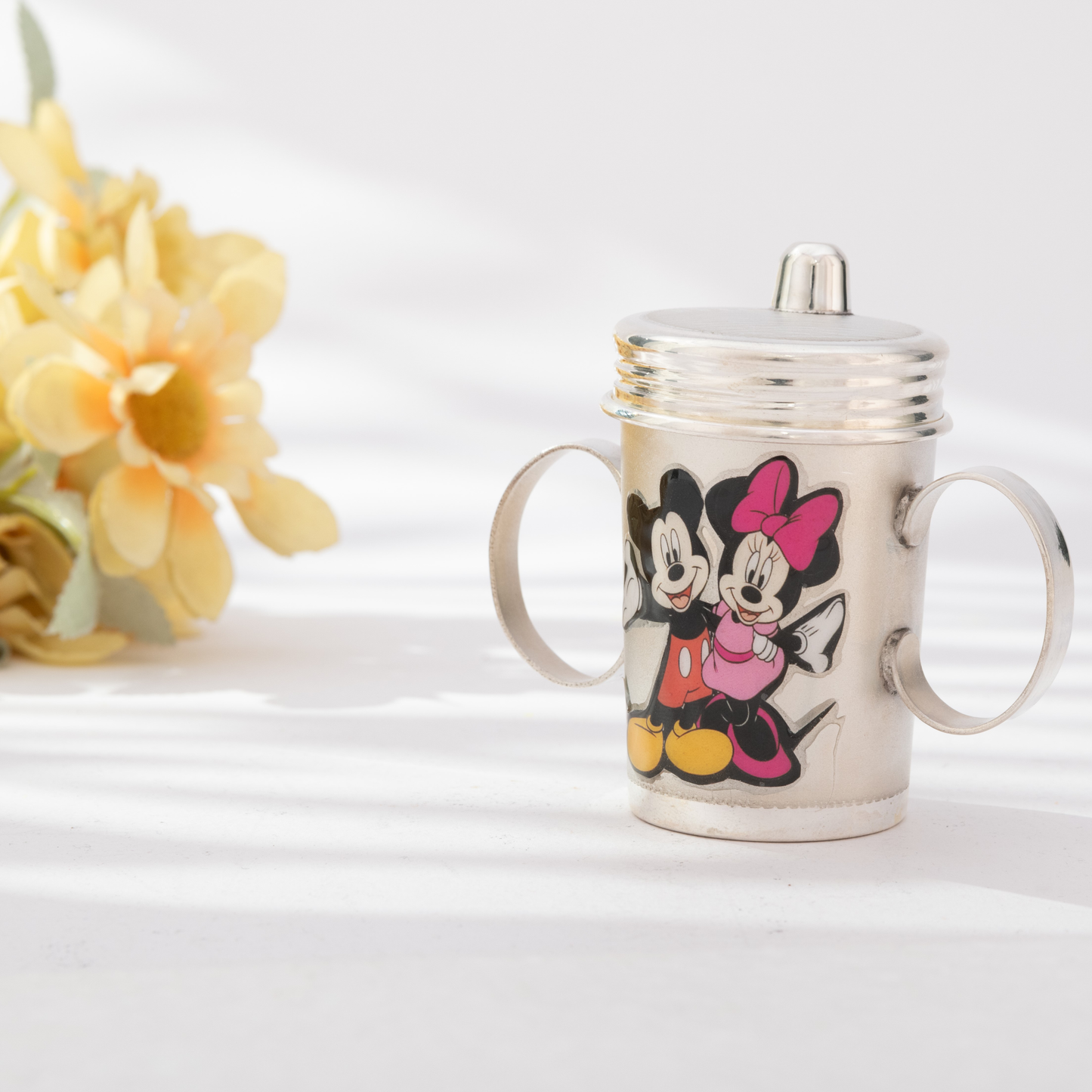 Graceful Silver Sipper Cup with Mickey Mouse and Minnie Mouse Design