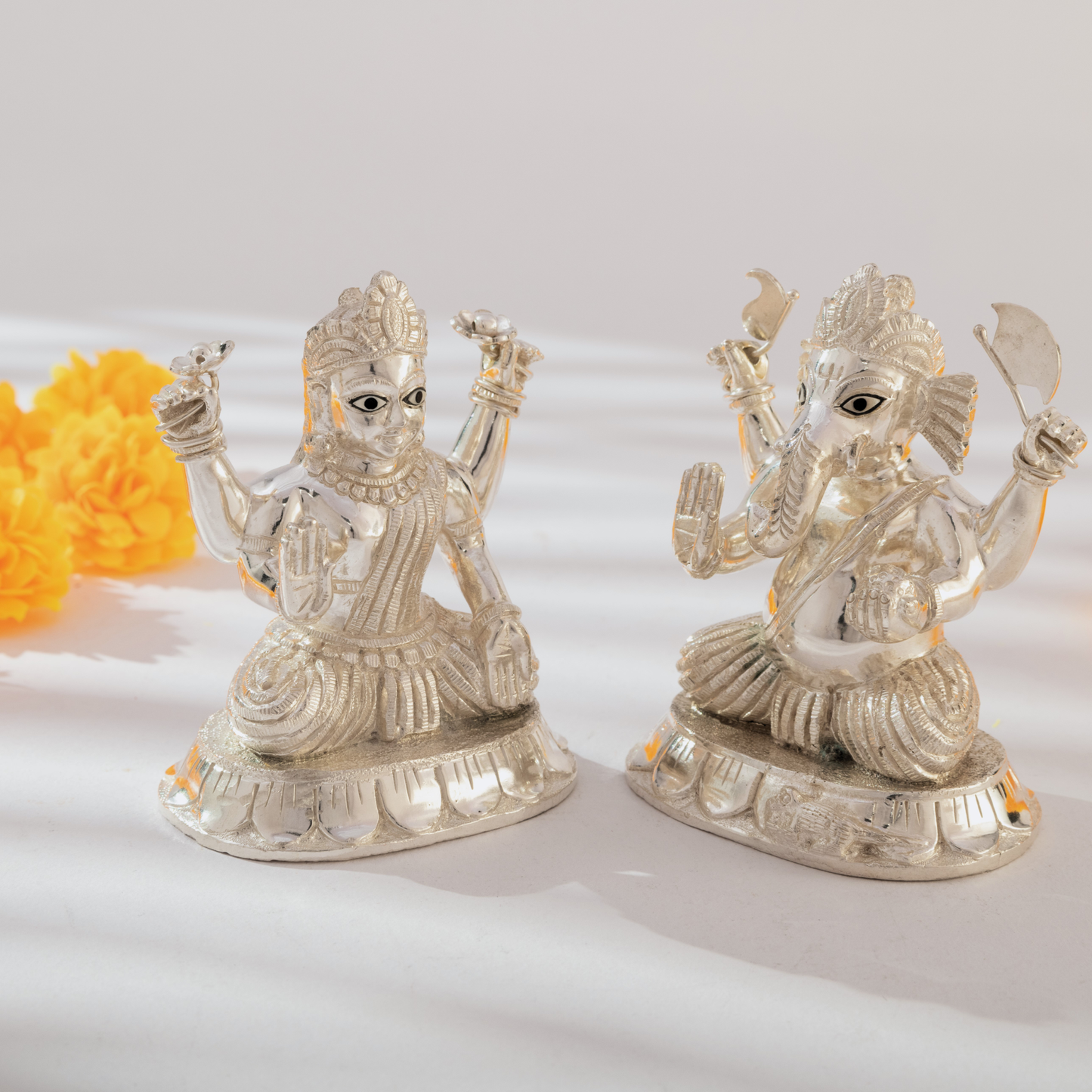 Lord Ganesh and Goddess Lakshmi Idol set in Sparkling Silver Finish